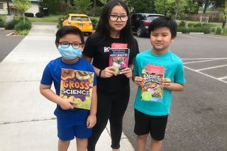 SMART Reading three kids with books