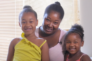 Photo of a mom and her two girls